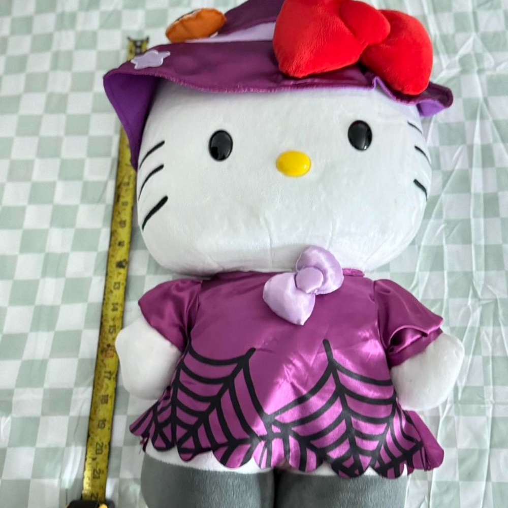 Purple and Gray Plush Toy with Red Bow